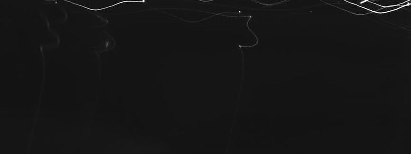 Abstract pattern of light streaks, conveying a sense of rhythm.